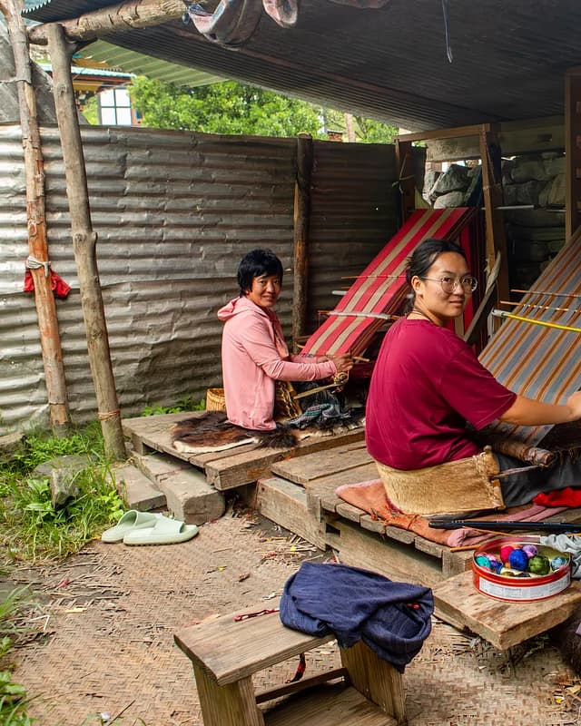 Traditional weavers at work in Lhuentse
