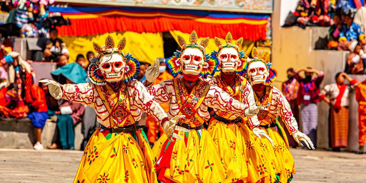 Masked dancers performing at the Thimphu Tshechu festival in Bhutan